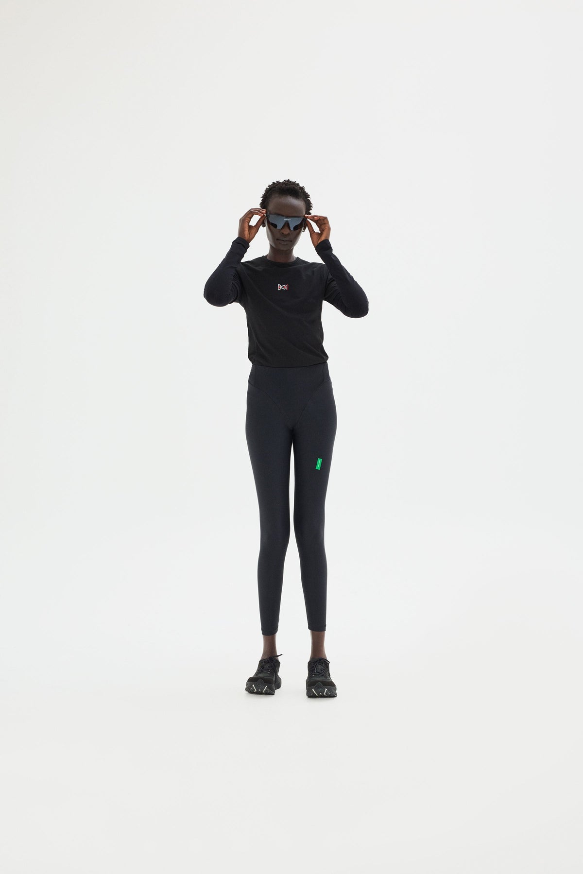 Full Length Interlock Tights in Black styled as a full outfit look by District Vision