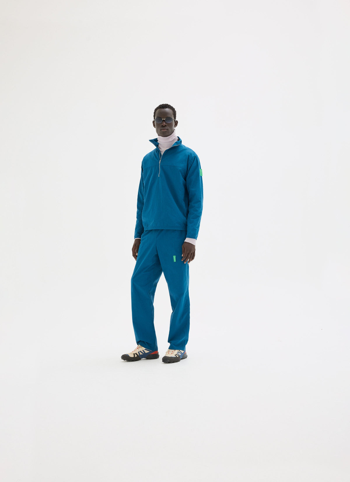 Nylon Tussar Pants in Coral styled as a full outfit look by District Vision